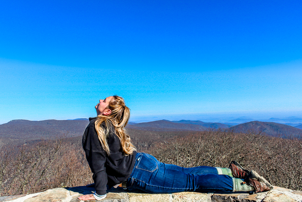 Girl doing cobra with mountain in background