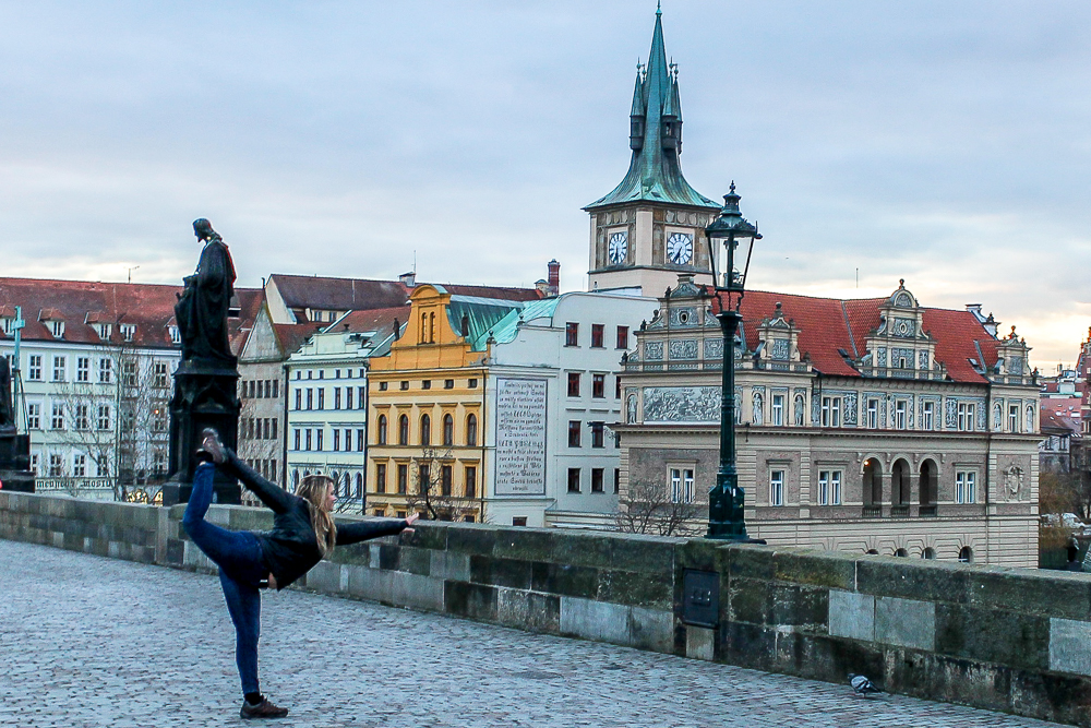 Dancers pose on Charles Bridge in Prague