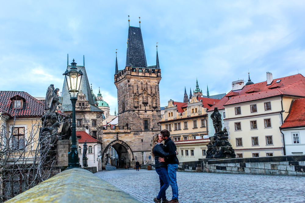 Couple kissing on Charles Bridge