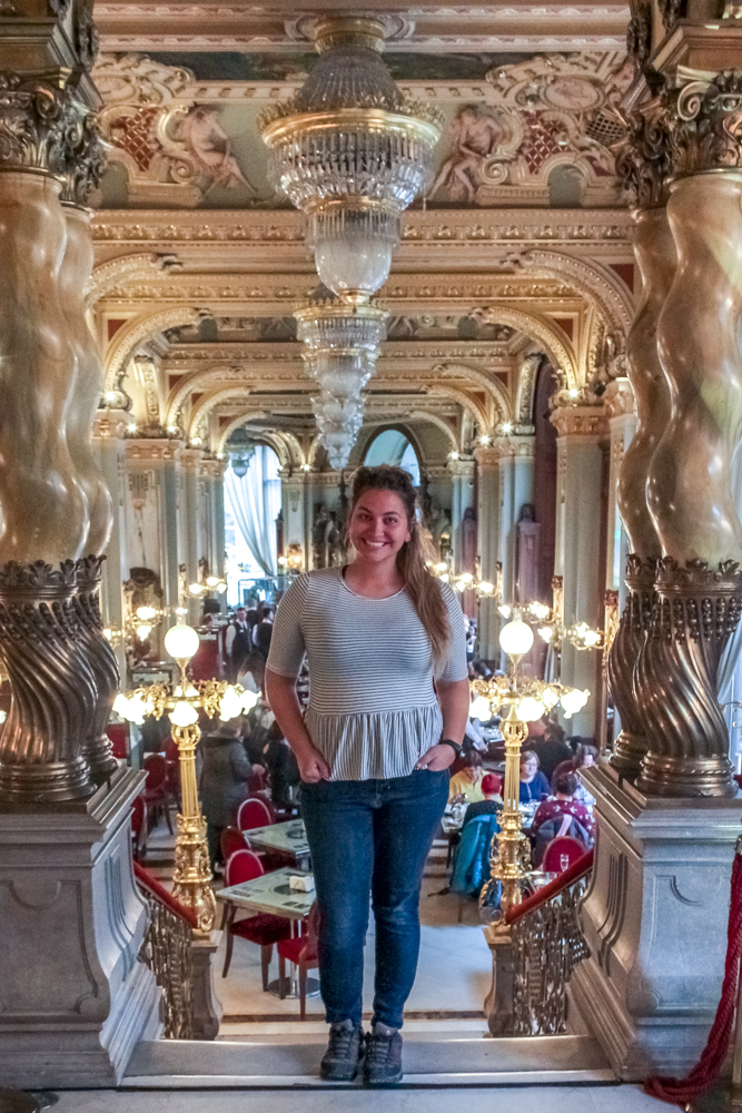 Girl standing inThe New york Cafe in Budapest