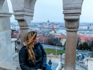 Girl looking out onto the city of Budapest