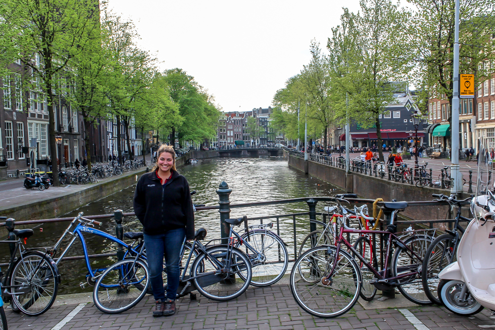 Girl in front of canal in Amsterdam