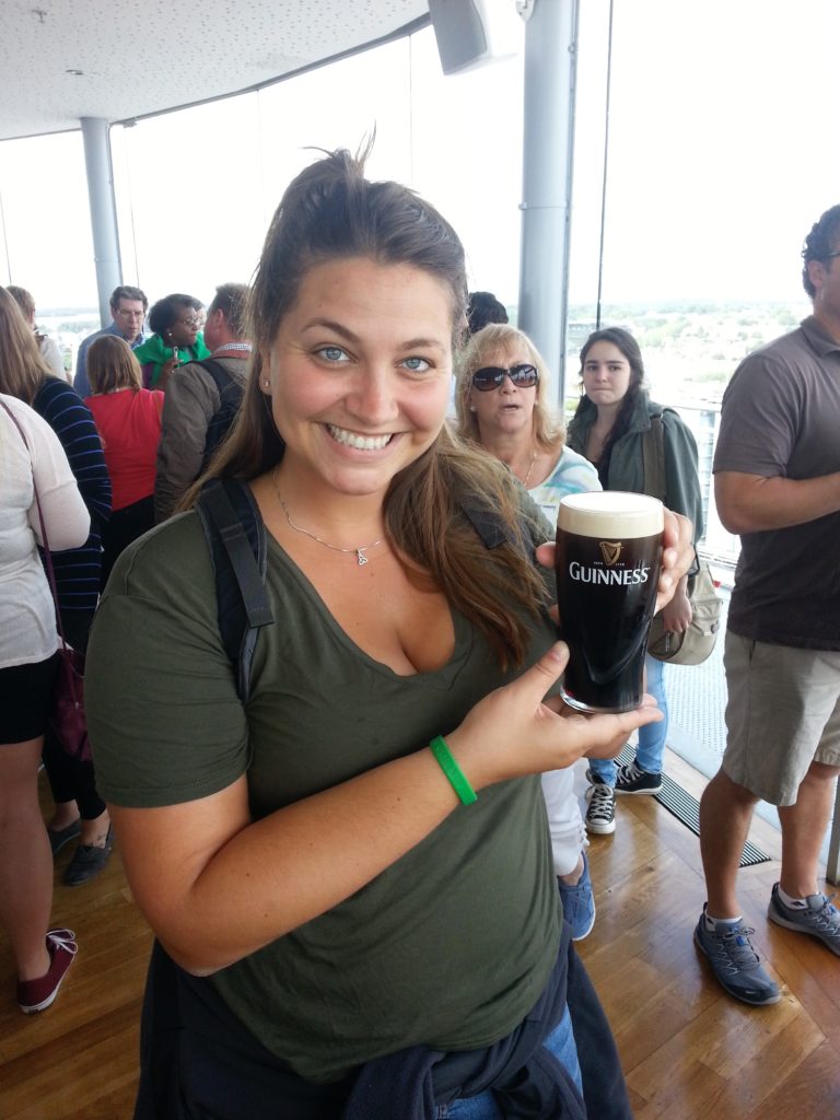girl holding guiness beer